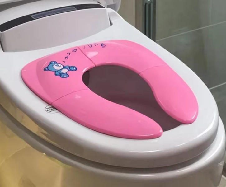 TinyTots - Kompakter Baby Toilettensitz für stressfreie Ausflüge